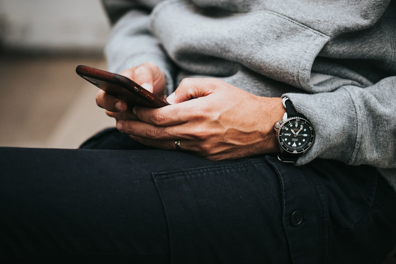 Customers use smartphones at a modern electronics store counter